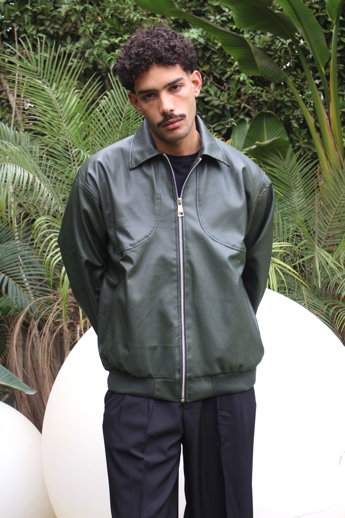 Green Leather Jacket worn zipped up outdoors