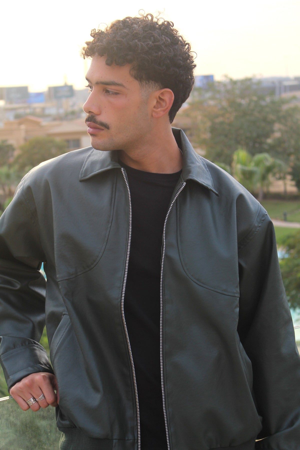 Green Leather Jacket worn outdoors